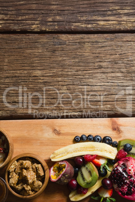 Breakfast and fruits on chopping board