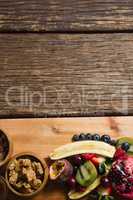Breakfast and fruits on chopping board