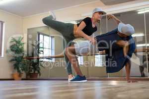 Full length of friends rehearsing dance