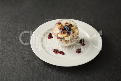 Fruit cereal in jar on concrete background