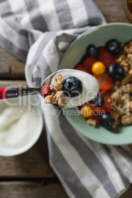 Yogurt and blueberry in a spoon