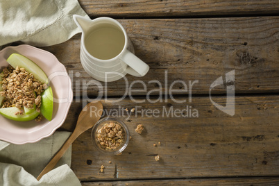 Plate of breakfast cereals with fruits and milk