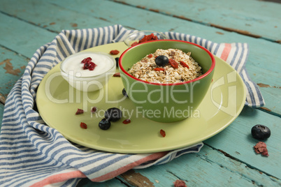 Oatmeal in bowl on a wooden table