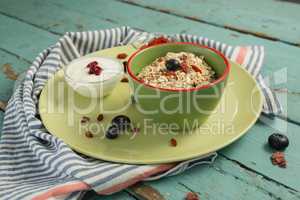 Oatmeal in bowl on a wooden table