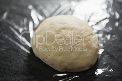 Unbaked dough on plastic wrap