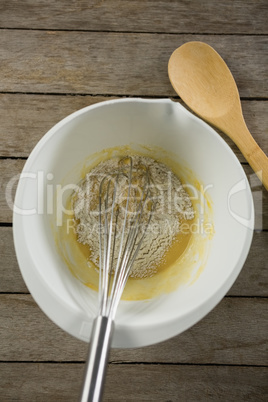 Overhead view of egg and flour batter in bowl