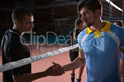 Volleyball players shaking hands