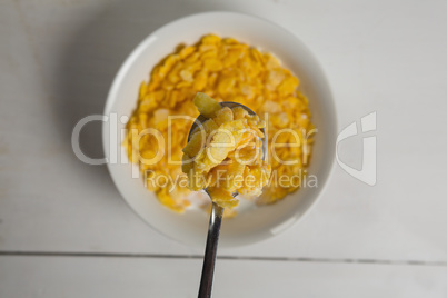 Breakfast cereal in bowl on a wooden table
