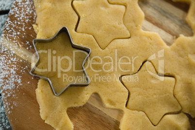 Overhead view of star shape cutter on dough