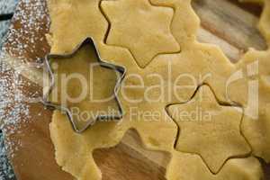 Overhead view of star shape cutter on dough