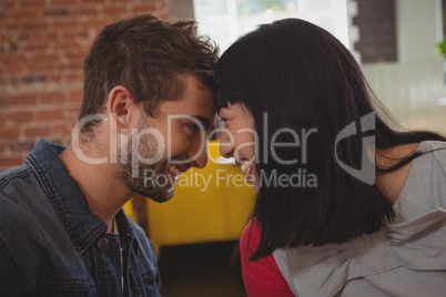 Couple looking each other in cafe