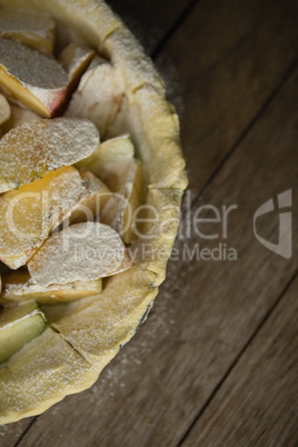 Close up of apple slices on pastry dough in baking pan