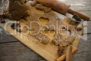 High angle view of dough with rolling pin