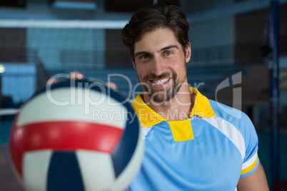 Portrait of man with volleyball