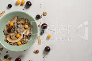 Bowl of wheat flakes with blueberry and golden berry