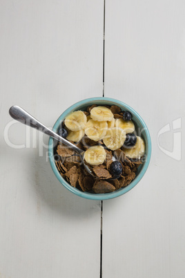 Bowl of wheat flakes with fruits