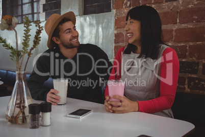 Couple having drinks in cafe