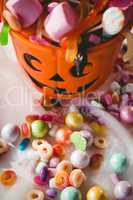 High angle view of bucket with various sweet food