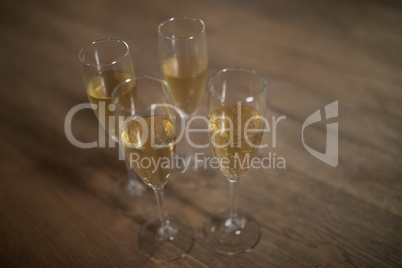 Glasses of champagne arranged on table