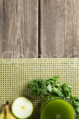 Fresh kale juice on wooden table