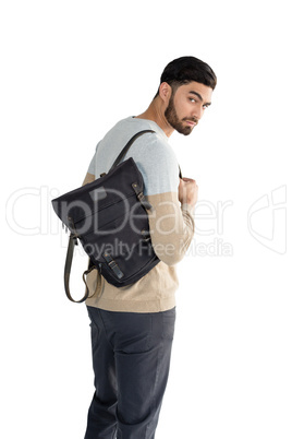 Handsome man posing with bag against white background