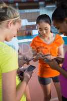 Female players using mobile phones