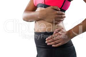 Mid section of female athlete with back pain