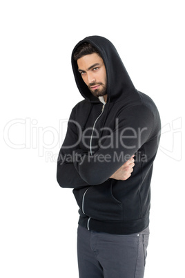Man posing with arms crossed against white background
