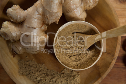 Overhead view of ginger with powder in plate