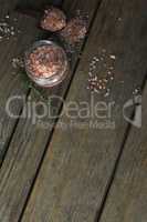 Himalayan salt and rosemary on wooden table