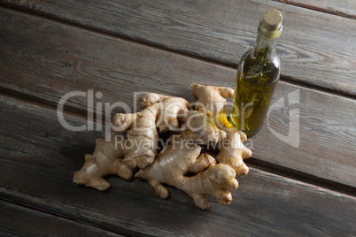 High angle view of oil and gingers on table