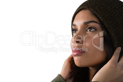 Thoughtful young woman against white background