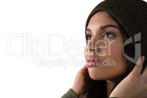 Thoughtful young woman against white background