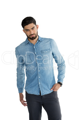 Portrait of handsome man posing with hands in pocket