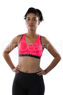 Confident female athlete against white background