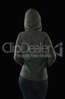 Rear view of female athlete in hooded jacket