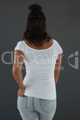 Rear view of young woman standing