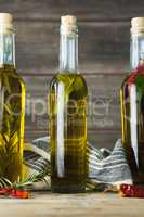 Olive oil bottles with herbal and spices