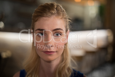 Confident woman sitting in restaurant