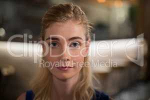 Confident woman sitting in restaurant