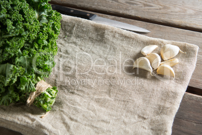 Kale leaves with garlic on napkin