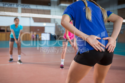 Volleyball players practicing in the court