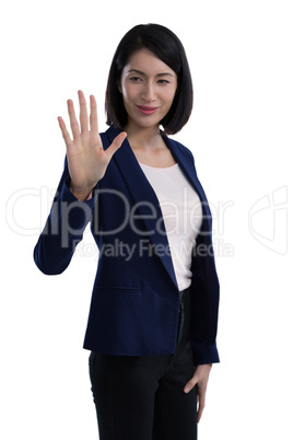 Businesswoman touching invisible screen