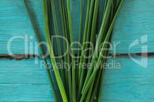 Garlic chives on wooden table