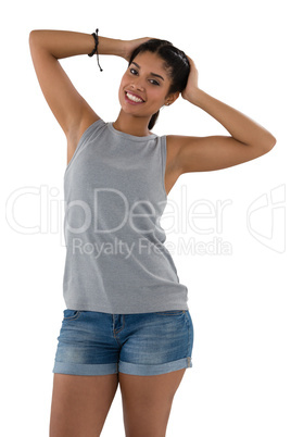 Portrait of smiling young woman in hot pants