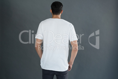 Man posing against grey background