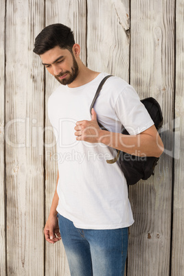 Man posing against wooden background