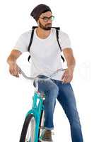 Man posing with bicycle against white background