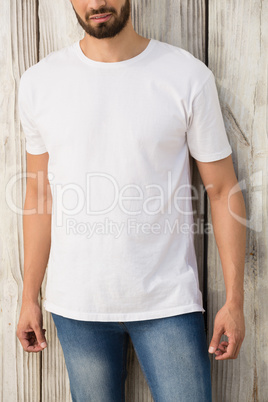 Man posing against wooden wall Man posing against wooden wall