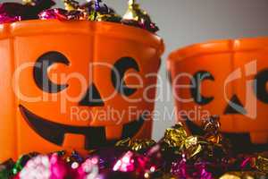 Close up of orange buckets with colorful chocolates